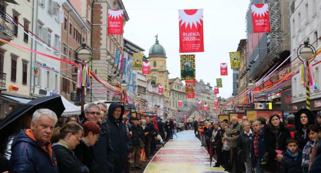 Rijeka residents waiting in the rain for the opening of 2020’s Capital of Culture. They’re used to the rain in Rijeka © Marc Rowlands