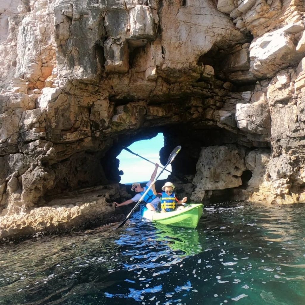 Kayakers explore the cave at Galebove Stijene, Pula with © Kayak centar Pula.