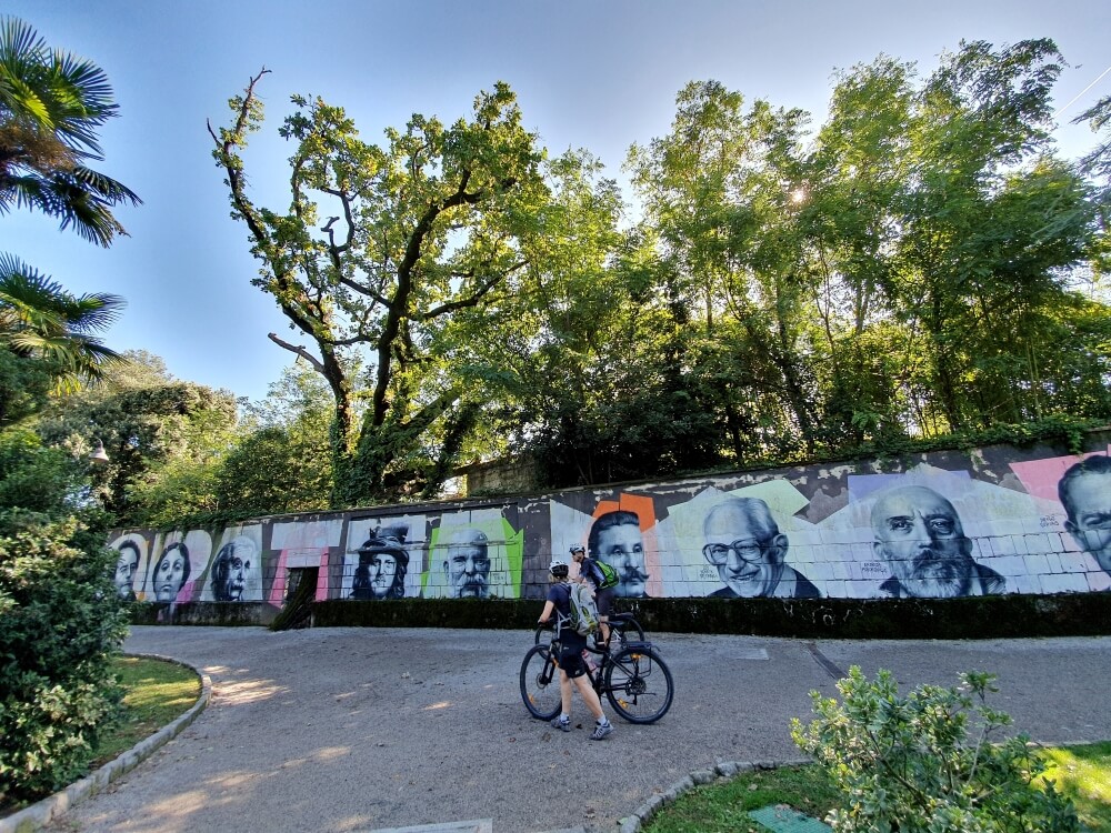 The mural depicting famous guests to Opatija, on the wall of the open-air theatre in Angiolina park