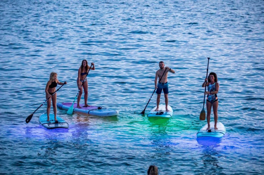 Upright paddle boarding off Verudela