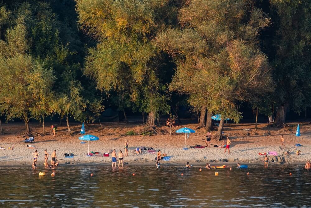 Swimmers and sunbathers on the island of Vukovar