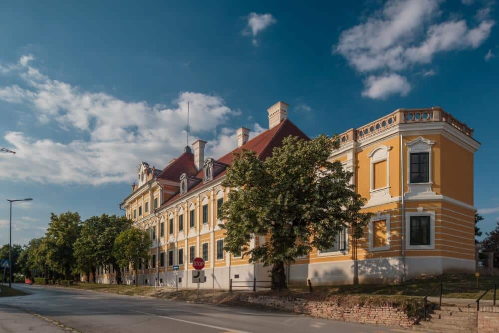 Set against blue skies, Eltz Manor (Dvorac Eltz), now Vukovar City Museum
