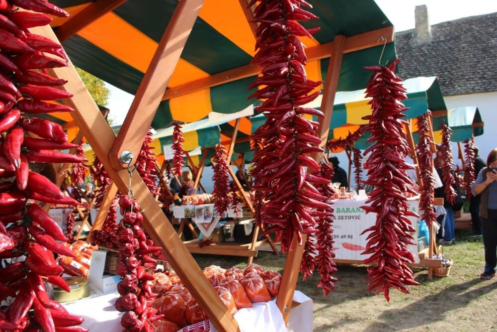 Bags of paprika powder and strings of peppers in in Lug, Baranja