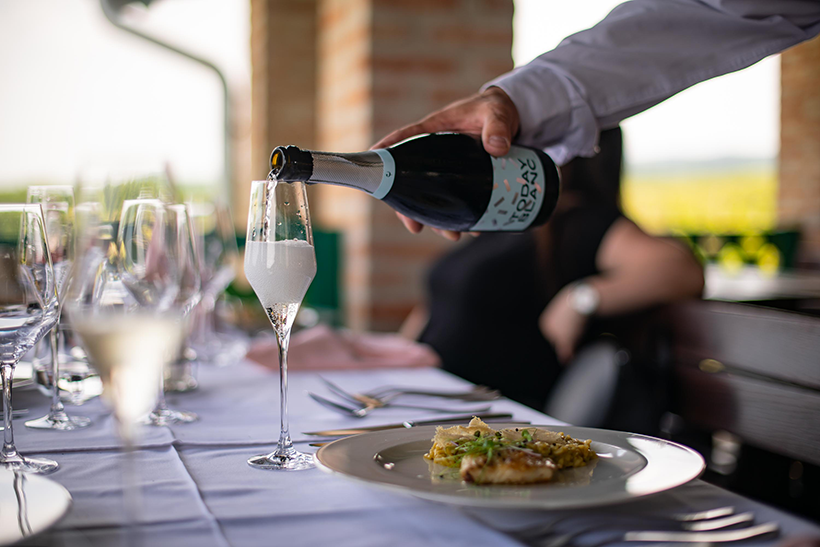 Image of Enosophia Winery Today Blanc sparkling wine being served with a pairing dish